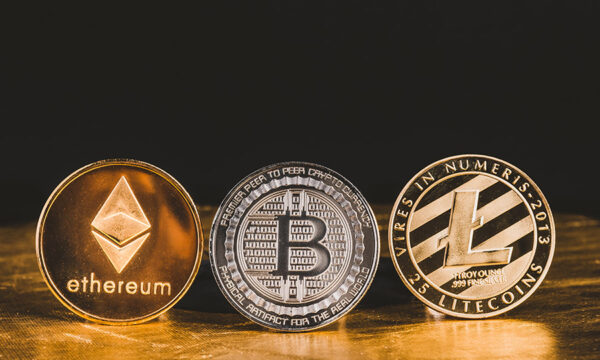 Cryptocurrency litecoin,Silver Bitcoin,Ethereum on golden floor and black background,Digital cryto currencies.Virtual money